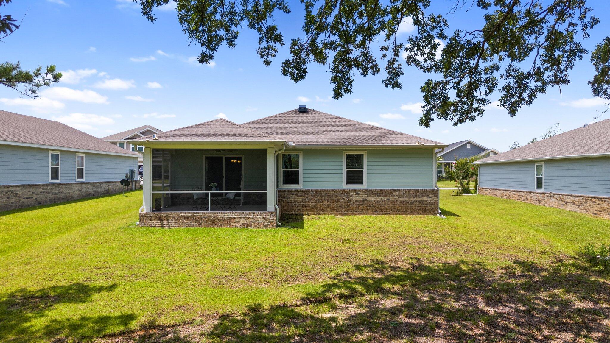 378 Marquis Way Freeport, FL 32439 - Photo 23 of 37 a house view with a swimming pool in front of it