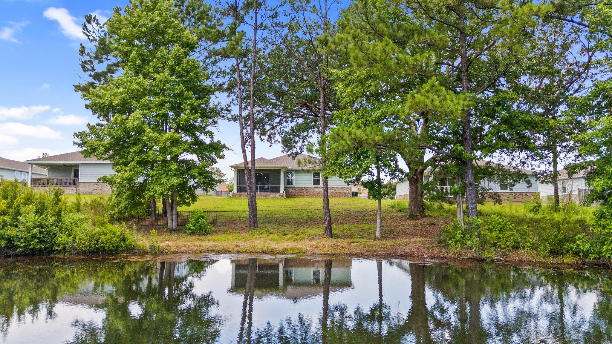 378 Marquis Way Freeport, FL 32439 - Photo 24 of 37 a lake view with large trees