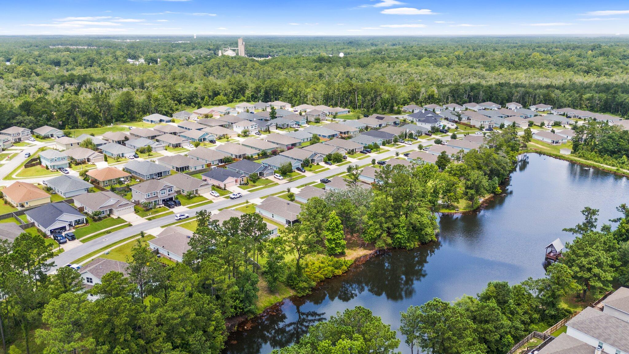 378 Marquis Way Freeport, FL 32439 - Photo 27 of 37 an aerial view of a house with a yard and lake view