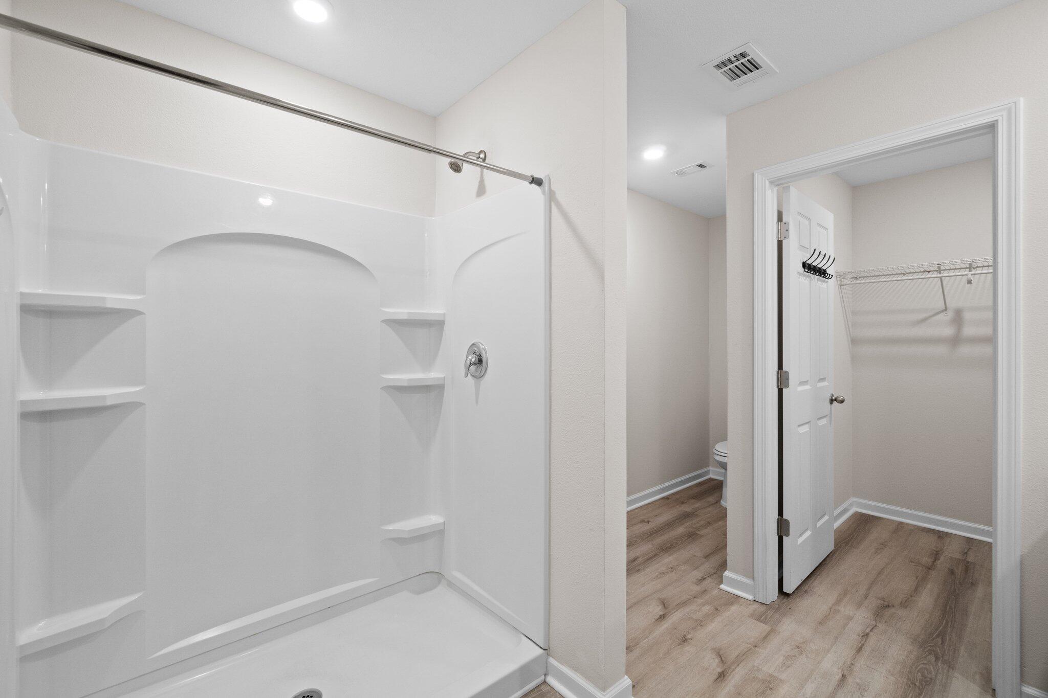 378 Marquis Way Freeport, FL 32439 - Photo 33 of 37 a bathroom with a shower and a toilet