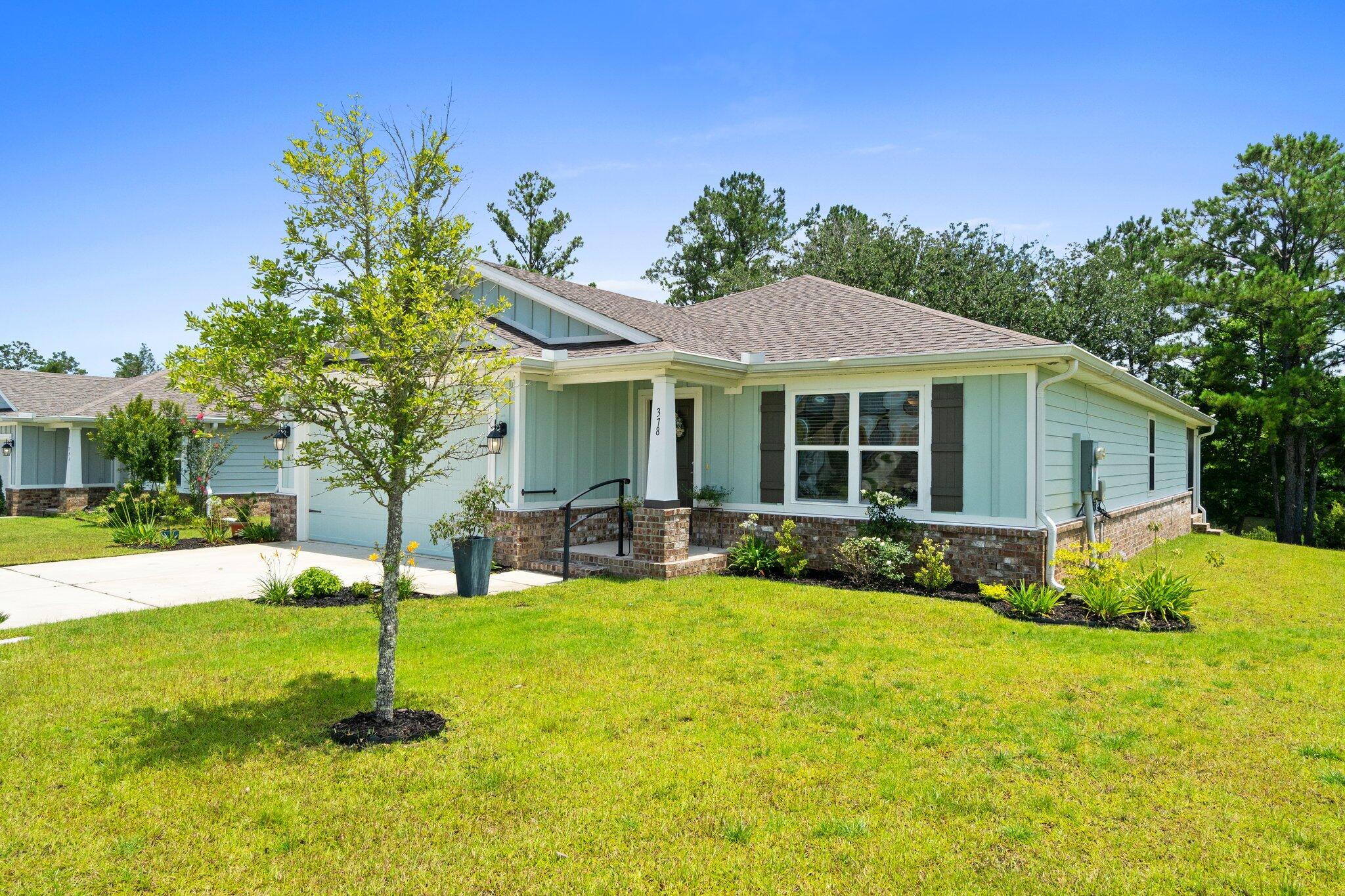 378 Marquis Way Freeport, FL 32439 - Photo 5 of 37 a view of a house with a yard and sitting area