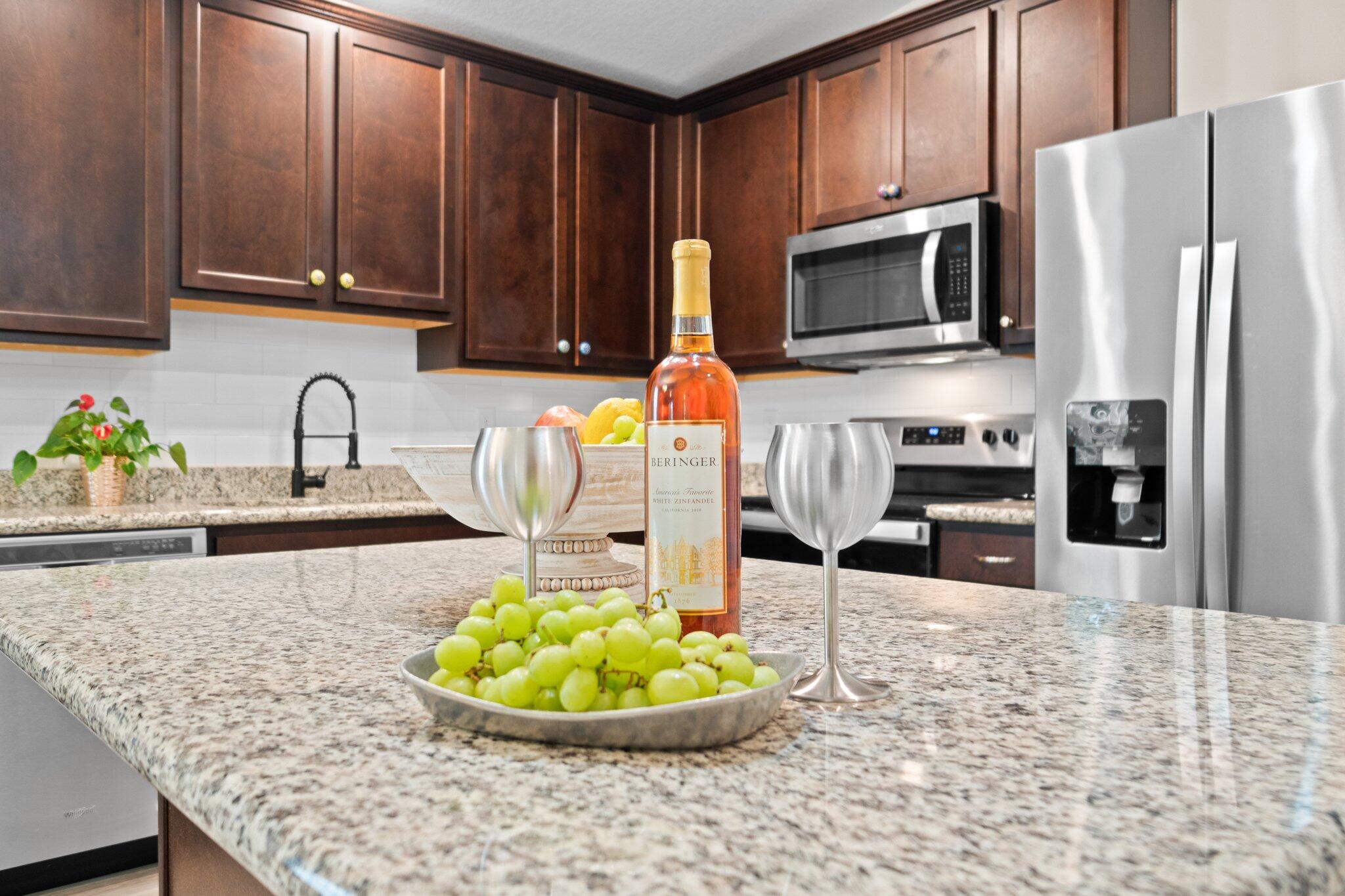 378 Marquis Way Freeport, FL 32439 - Photo 7 of 37 a kitchen with stainless steel appliances granite countertop a sink refrigerator and microwave