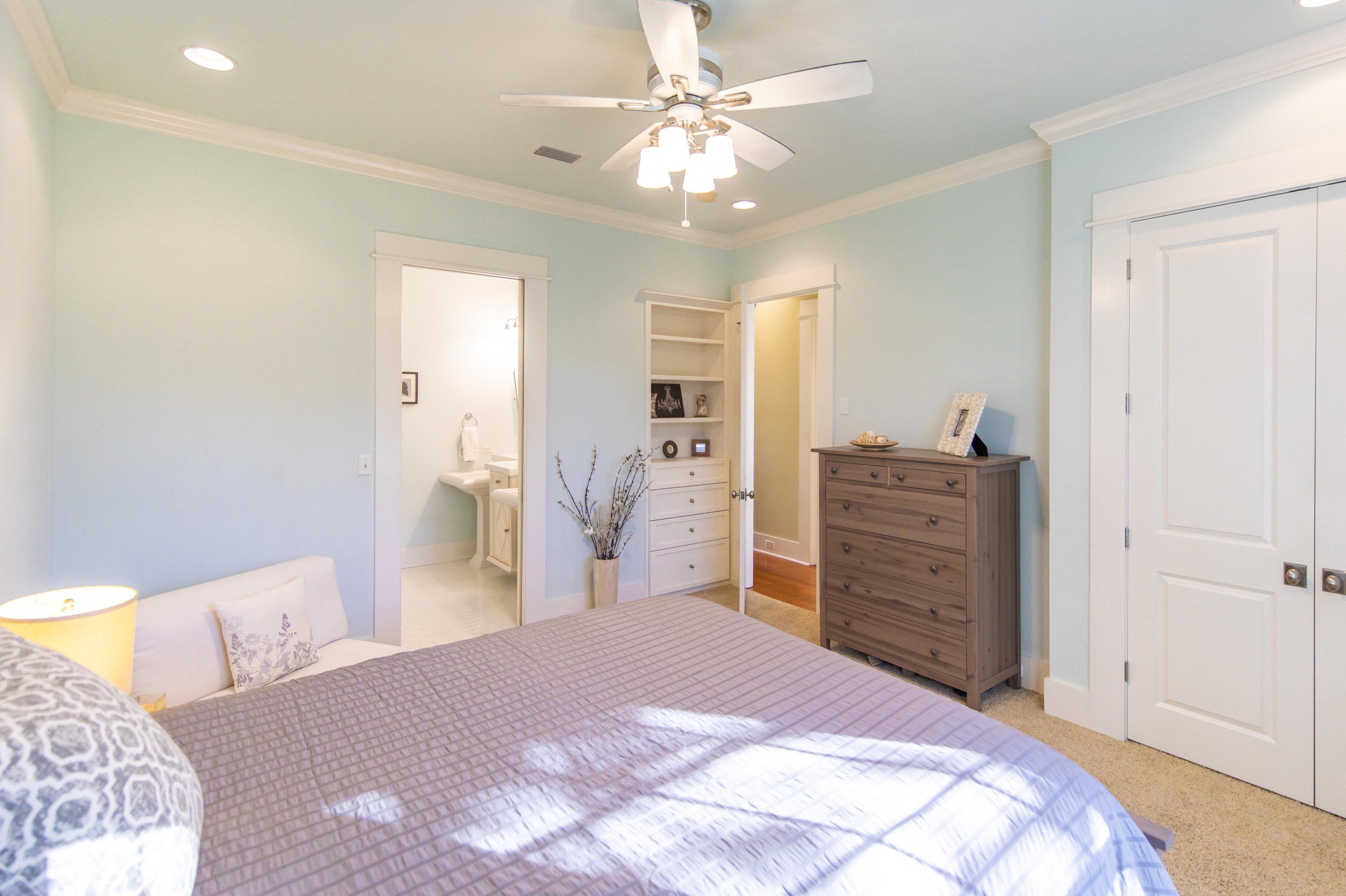 276 Grande Pointe Circle Inlet Beach, FL 32461 - Photo 15 of 33 a bedroom with a large bed and a chandelier