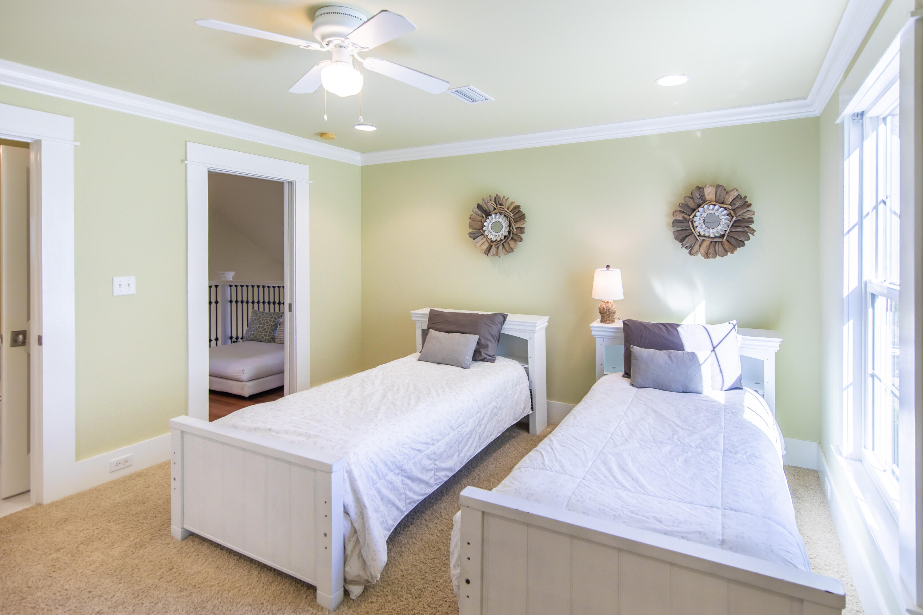 276 Grande Pointe Circle Inlet Beach, FL 32461 - Photo 23 of 33 a bedroom with two beds and a chandelier