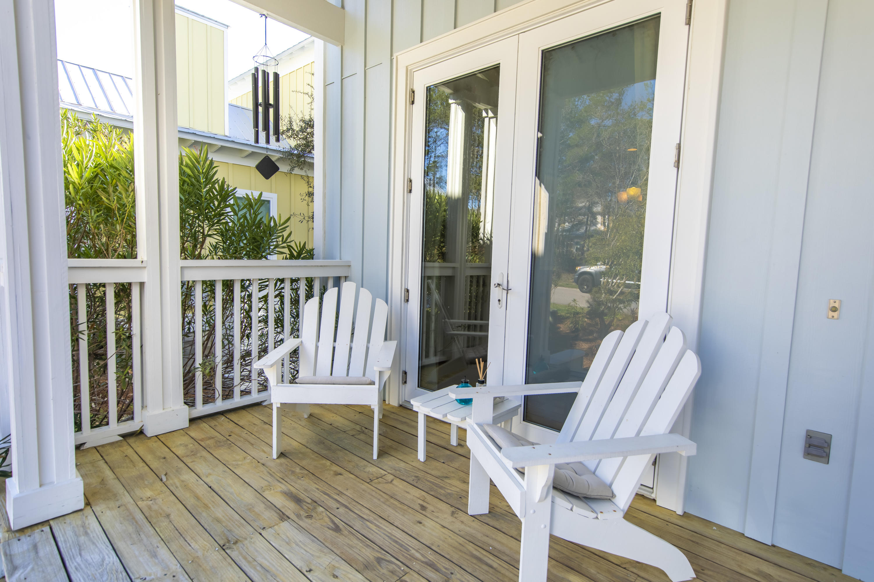 276 Grande Pointe Circle Inlet Beach, FL 32461 - Photo 3 of 33 a view of balcony with two chairs and wooden floor