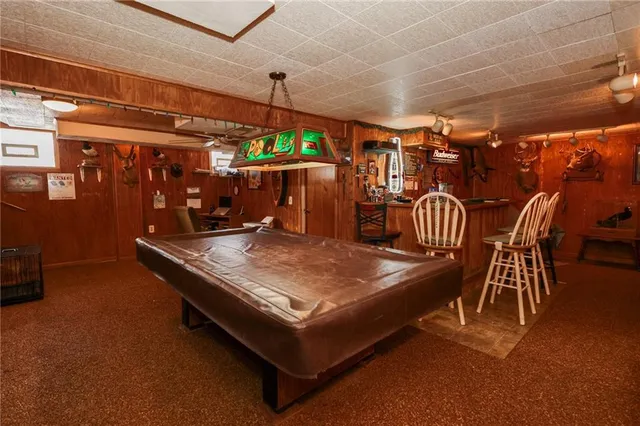 a view of a chairs and tables in the room