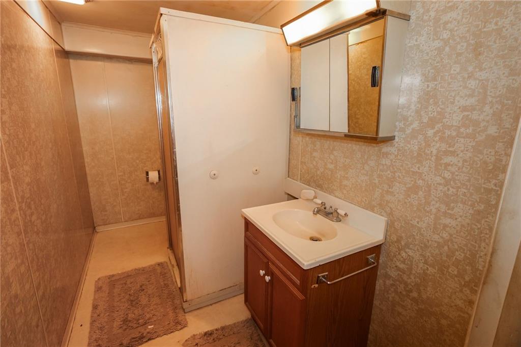 521 Mercer-New Wilmington Road Mercer, PA 16137 - Photo 21 of 35 a bathroom with a sink and a mirror