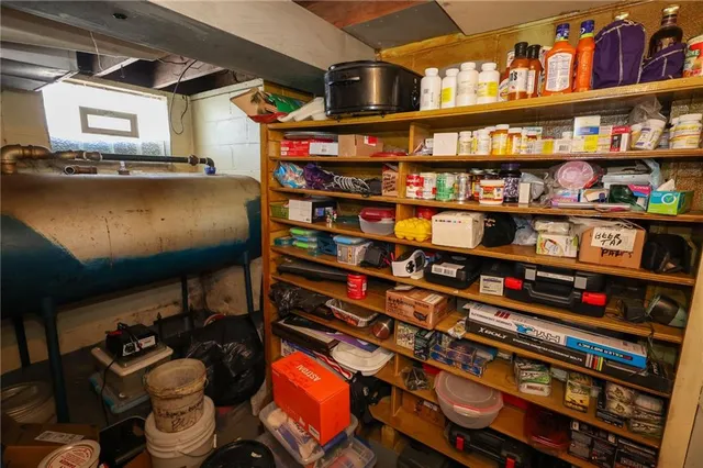 a room with lots of books and a book shelf