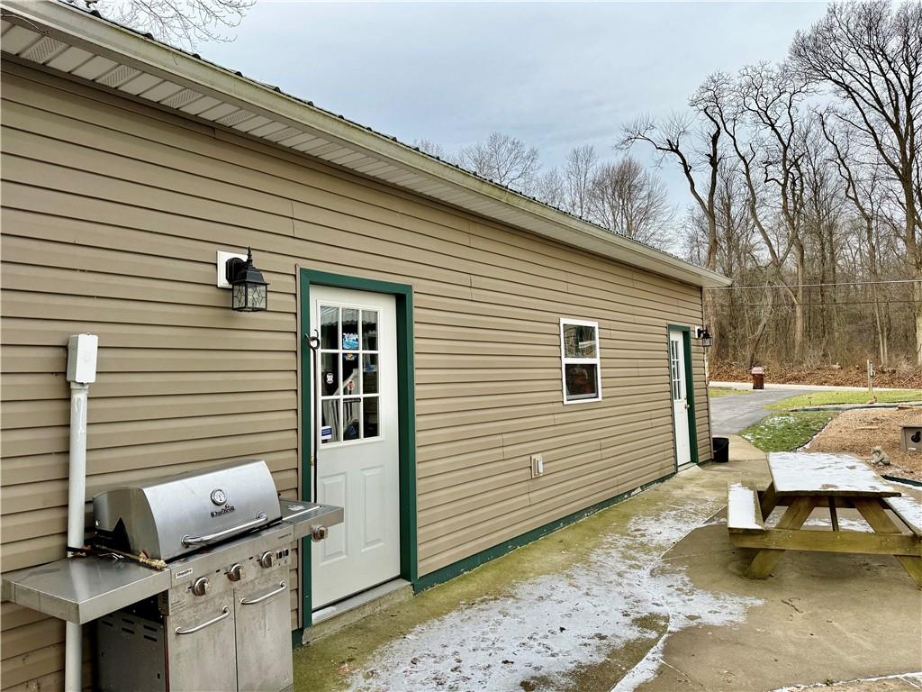 521 Mercer-New Wilmington Road Mercer, PA 16137 - Photo 26 of 35 a backyard of a house with outdoor seating