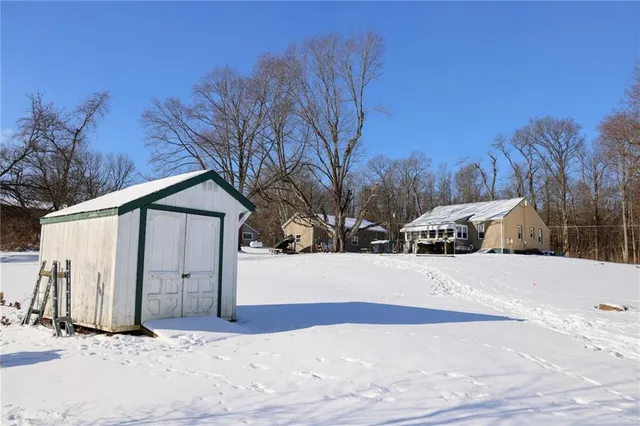 a view of a covered with snow in the yard