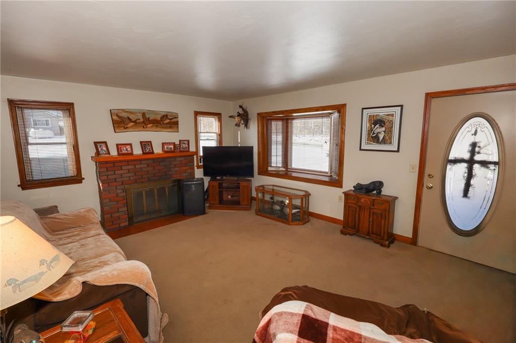 521 Mercer-New Wilmington Road Mercer, PA 16137 - Photo 7 of 35 a bedroom with furniture and a mirror