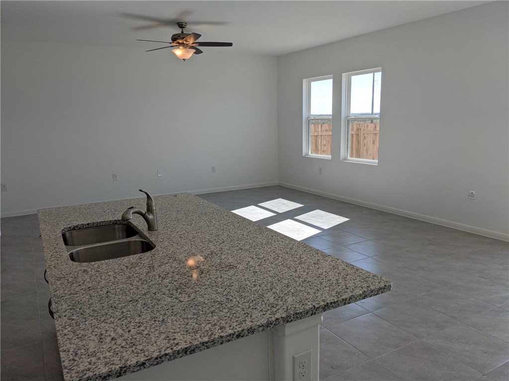 6705 Routenburn Street Austin, TX 78754 - Photo 3 of 18 a kitchen with granite countertop a sink and a granite counter tops