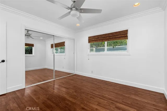 a view of a city from a balcony with seating space
