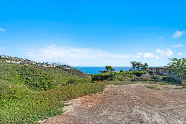 a view of a lake with couches and city view
