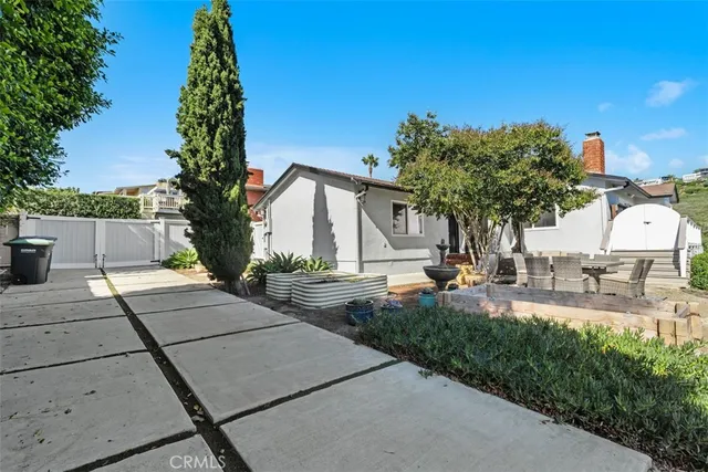 a aerial view of a house with yard swimming pool and outdoor seating