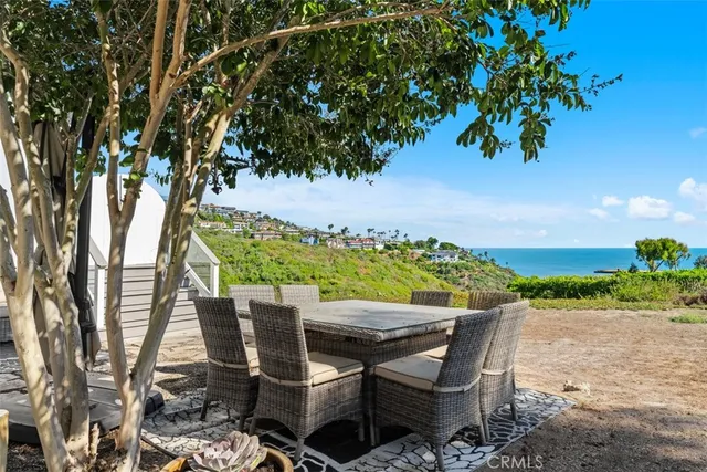 a view of an empty room with a fireplace and window