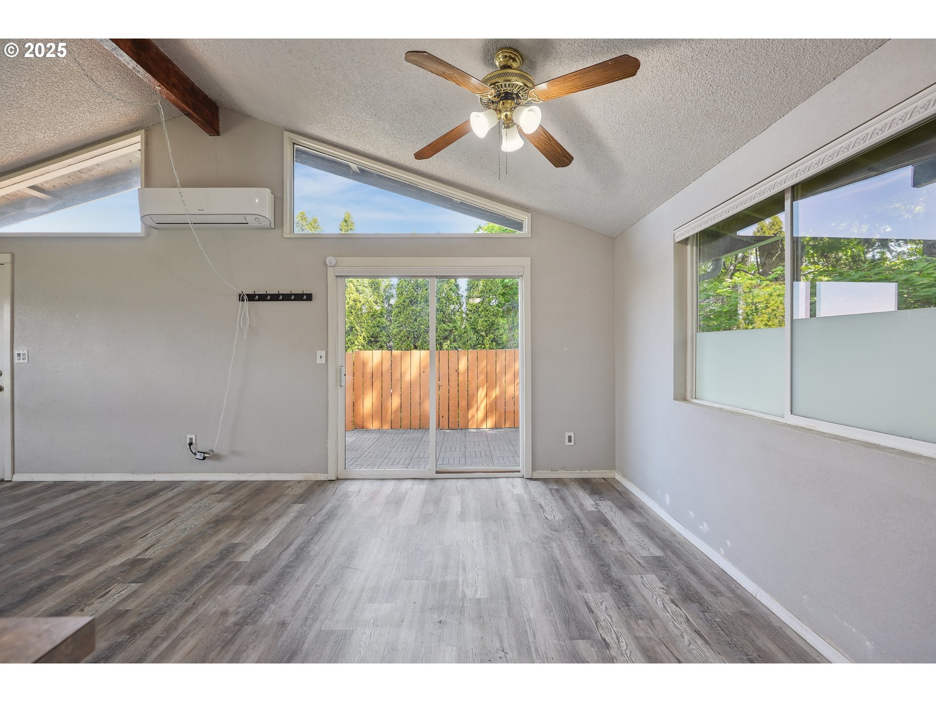 1510 Deborah Road, Unit 4 Newberg, OR 97132 - Photo 13 of 26 an empty room with wooden floor and windows