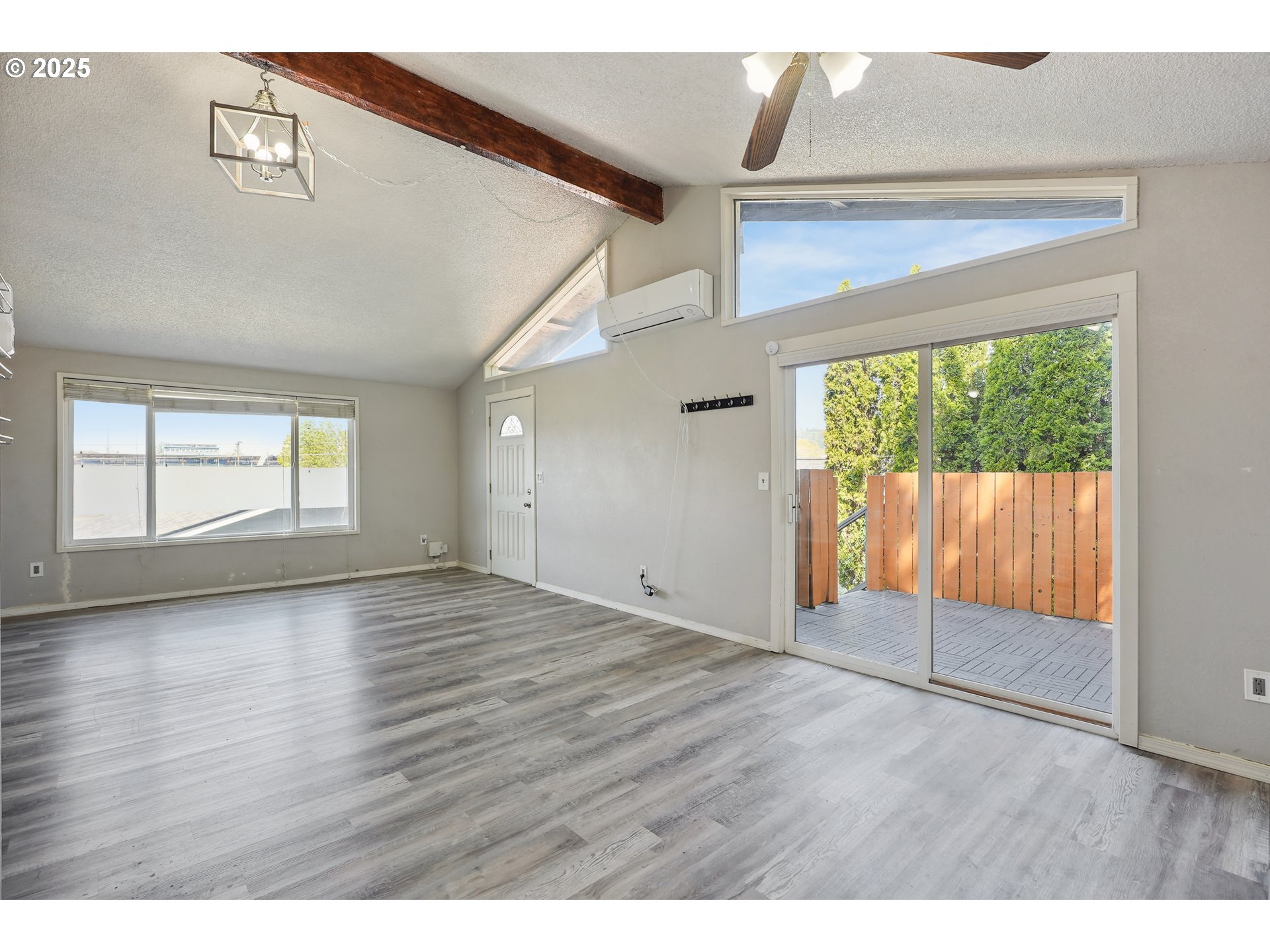 1510 Deborah Road, Unit 4 Newberg, OR 97132 - Photo 14 of 26 an empty room with wooden floor and windows