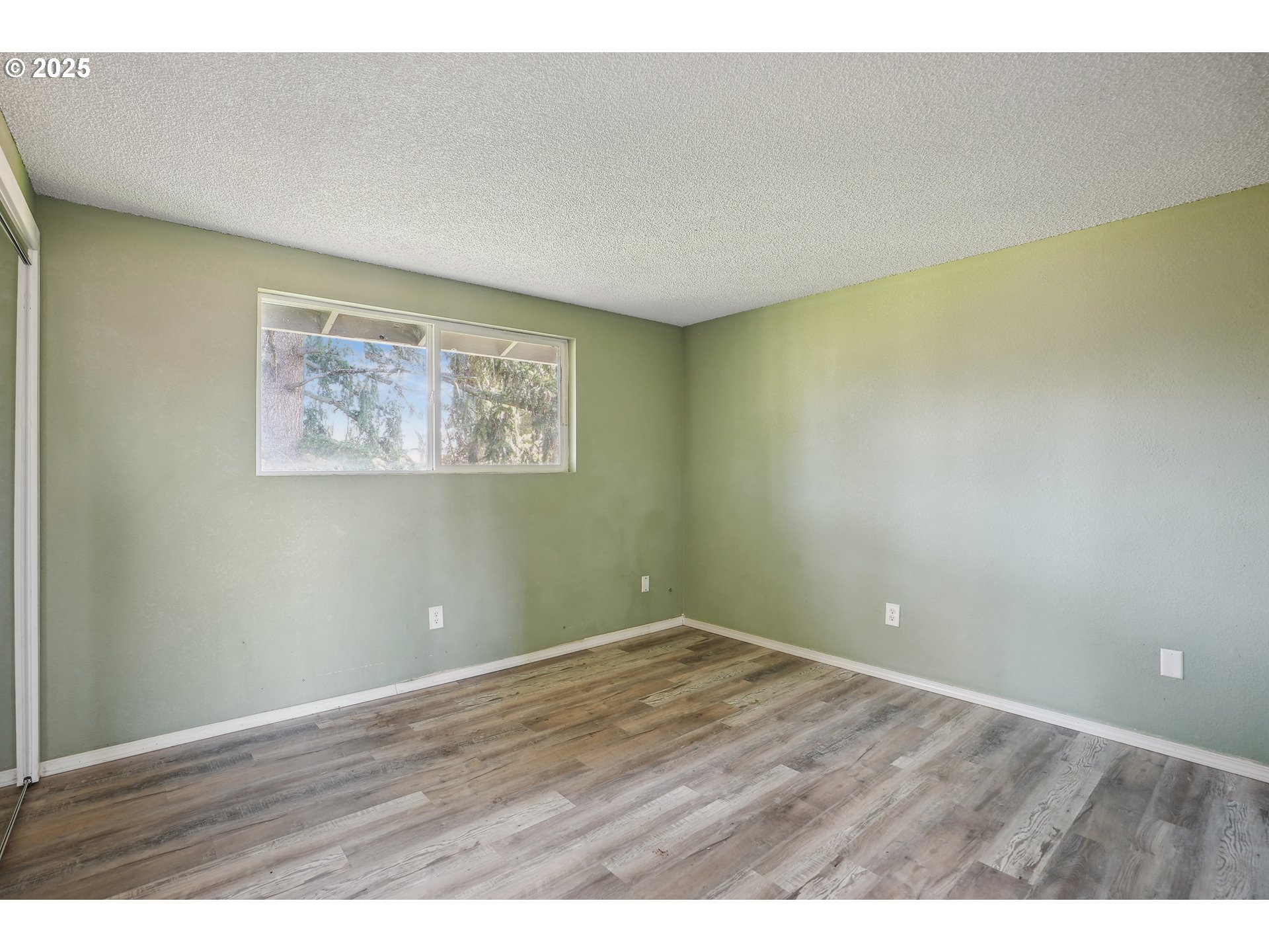 1510 Deborah Road, Unit 4 Newberg, OR 97132 - Photo 16 of 26 a view of an empty room with wooden floor