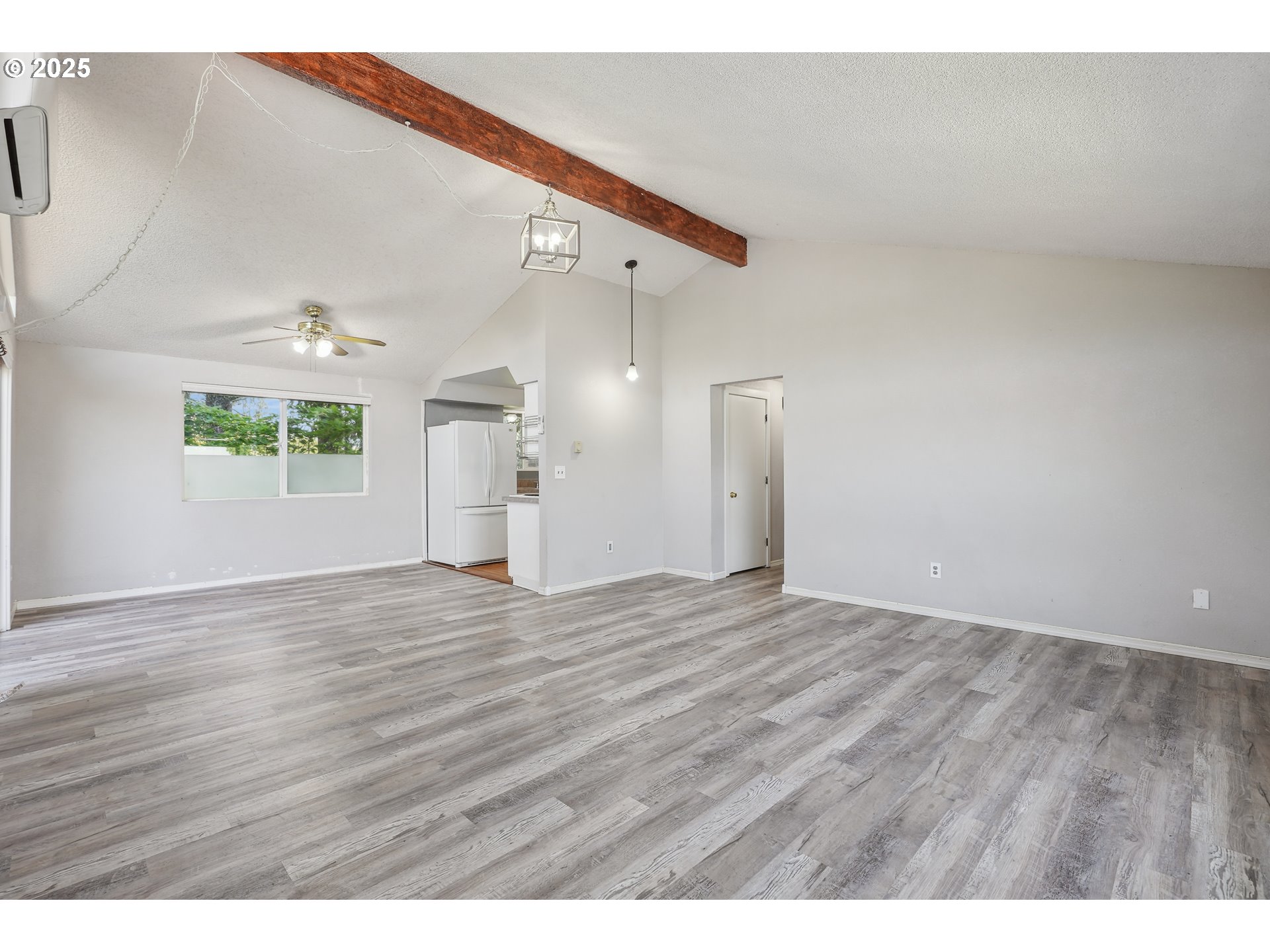 1510 Deborah Road, Unit 4 Newberg, OR 97132 - Photo 7 of 26 a view of an empty room with wooden floor and a window