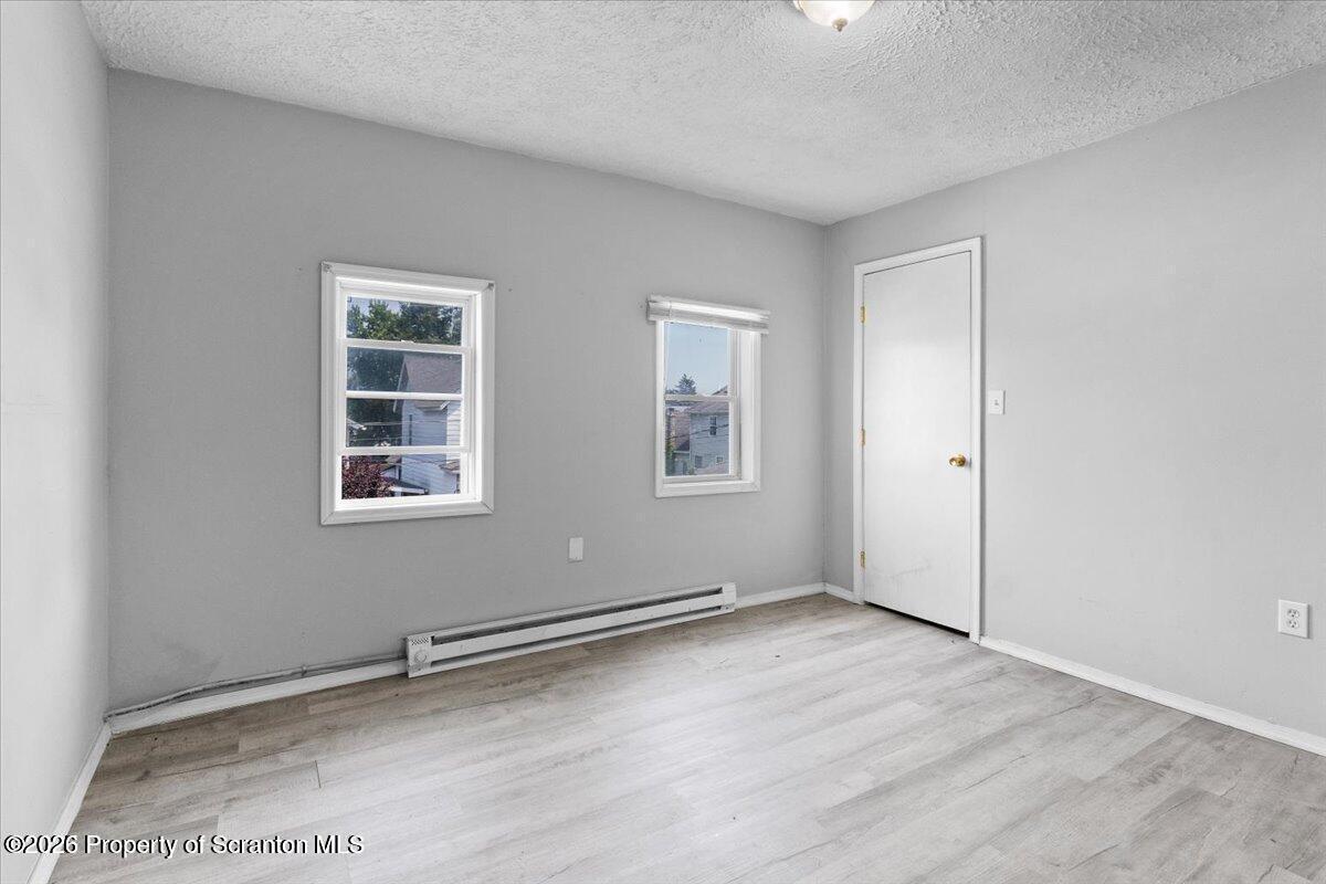 416 Electric Street Scranton, PA 18509 - Photo 5 of 9 an empty room with windows