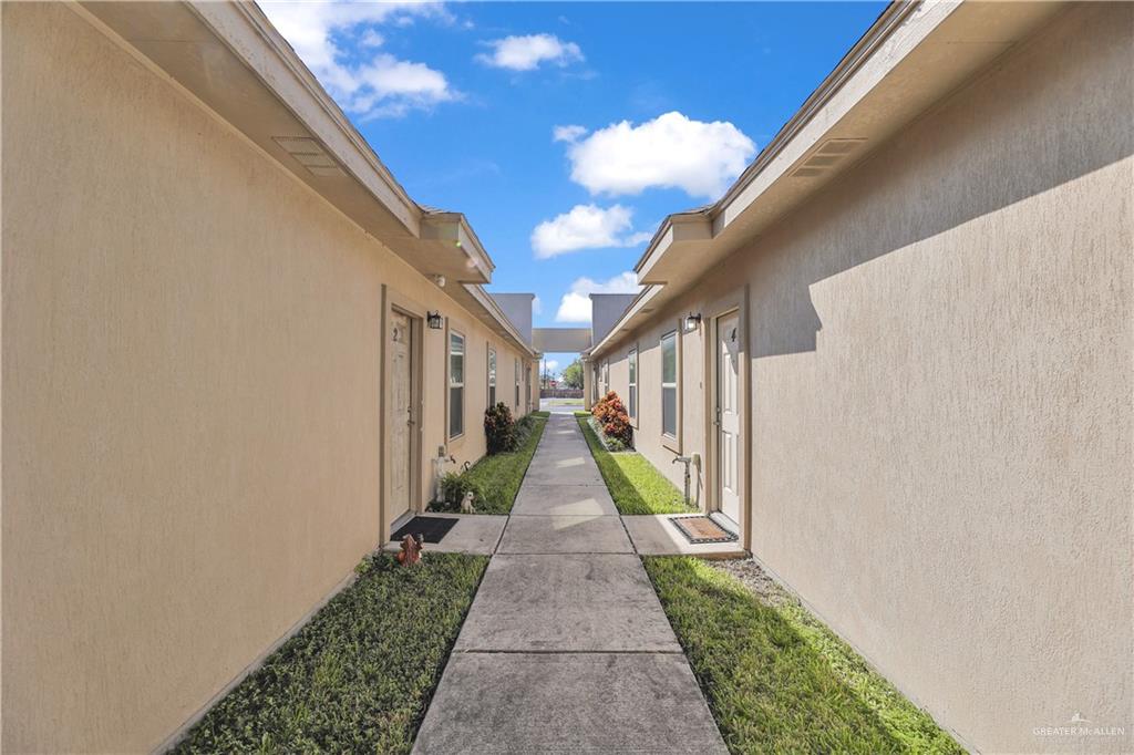 1017 East Myrtle Beach Avenue McAllen, TX 78503 - Photo 6 of 18 a view of a pathway with a white house