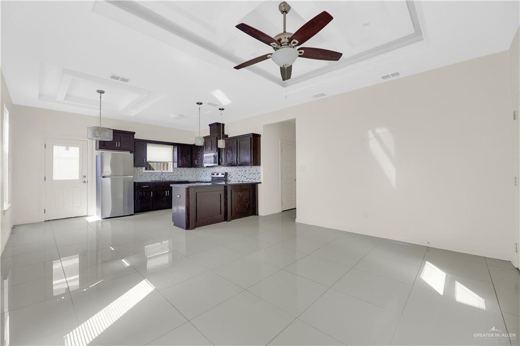 1017 East Myrtle Beach Avenue McAllen, TX 78503 - Photo 7 of 18 a large kitchen with cabinets and stainless steel appliances