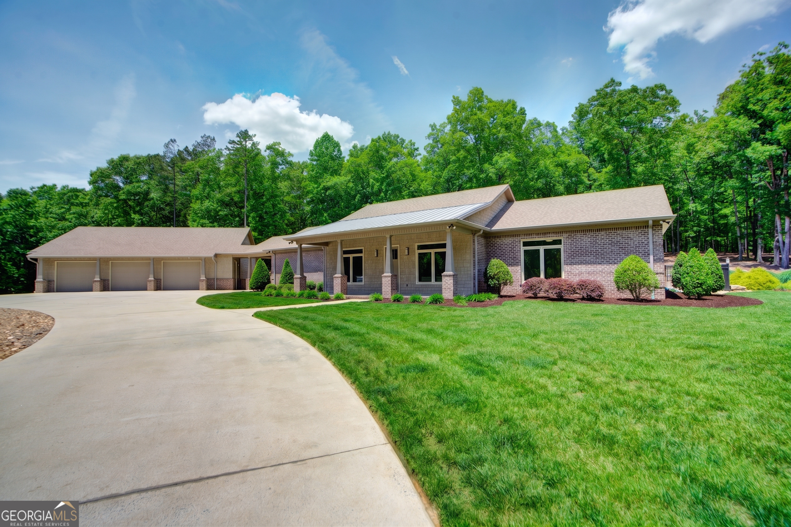 a front view of house with yard and green space