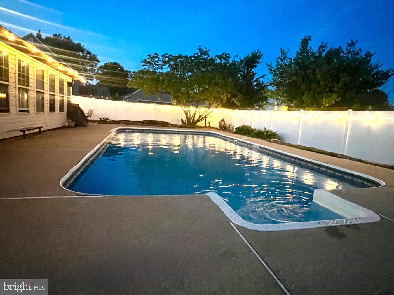 2904 Topaz Road Parkville, MD 21234 - Photo 1 of 10 Tranquil evening by the shimmering pool.