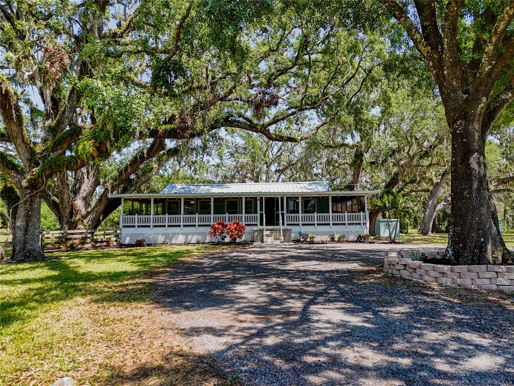 5870 Jim Davis Road Parrish, FL 34219 - Photo 1 of 1 a front view of a house with a garden