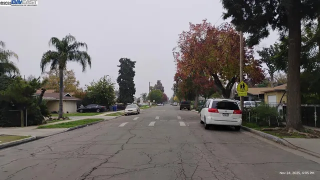 a view of street with parked cars