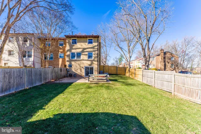 a view of swimming pool with outdoor seating and yard