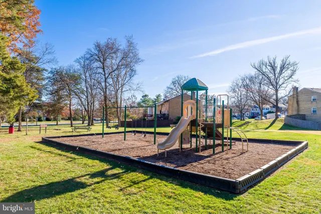 a view of a backyard with swimming pool