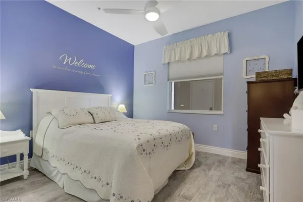 a bedroom with a bed and a television