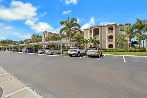 an aerial view of a house with garden space and lake view