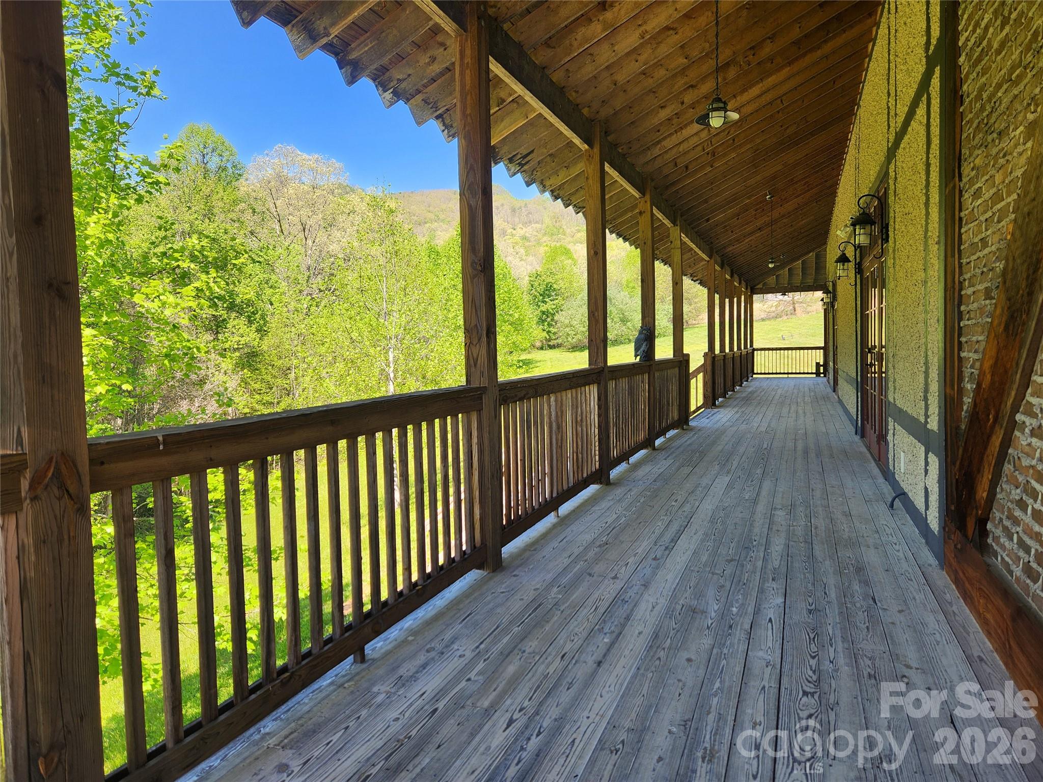 889 Firefly Trail Marshall, NC 28753 - Photo 34 of 35 a view of a porch with wooden floor and outdoor space