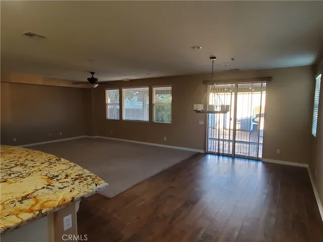 a view of a livingroom with wooden floor