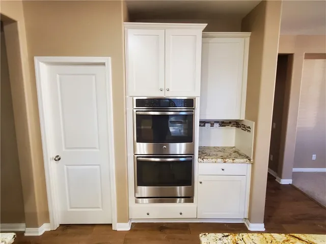a kitchen with appliances and cabinets