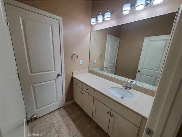a bathroom with a double vanity sink a and mirror