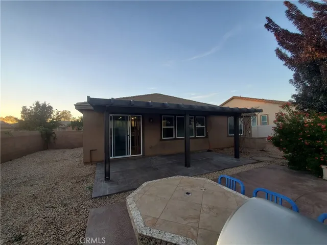 a front view of house with yard nad seating space