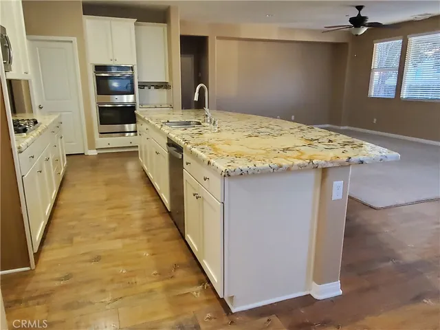 a kitchen with a stove and a kitchen island