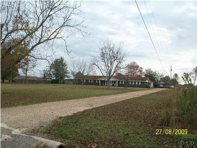 0 Airport Road Atmore, AL 36502 - Photo 8 of 9 This is a view of the house located directly beside the property