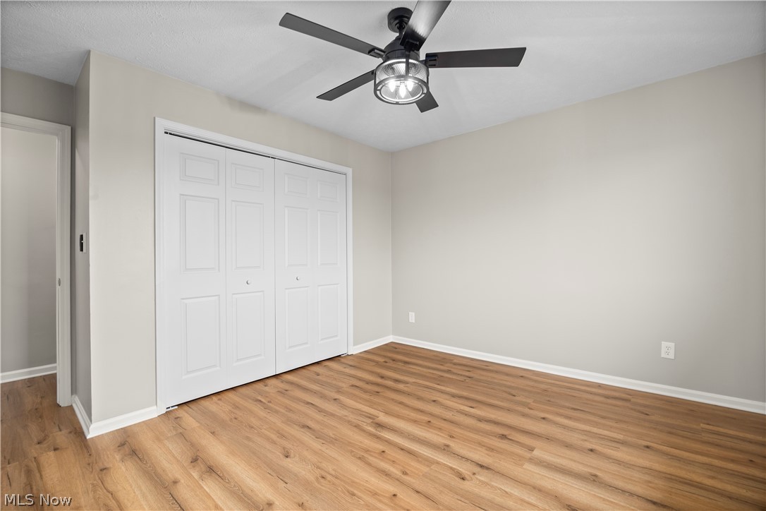 36220 Neff Road Grafton, OH 44044 - Photo 26 of 50 Unfurnished bedroom with a closet, light wood finished floors, and ceiling fan