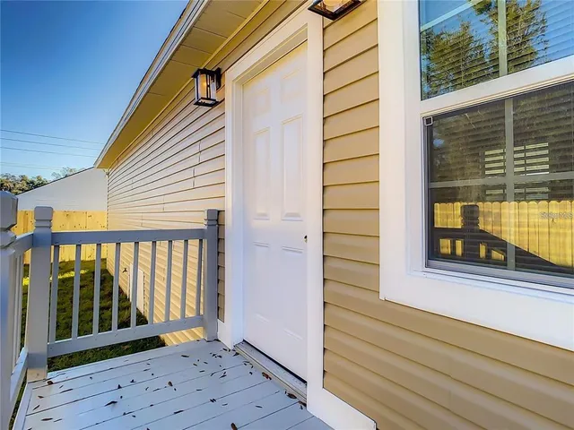 a view of a balcony with a potted plant