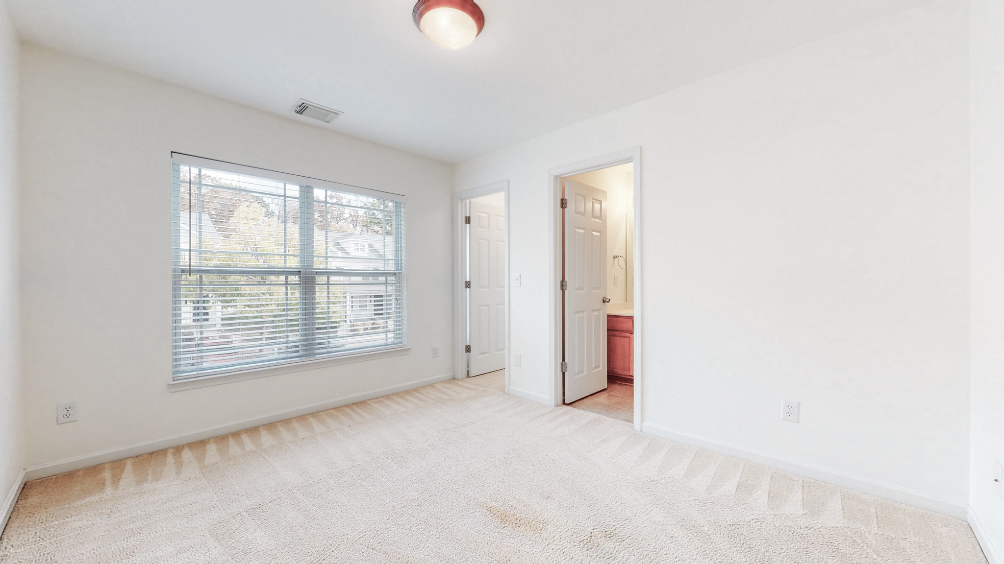 1382 Rural Hill Road, Unit 186 Antioch, TN 37013 - Photo 17 of 21 an empty room with windows