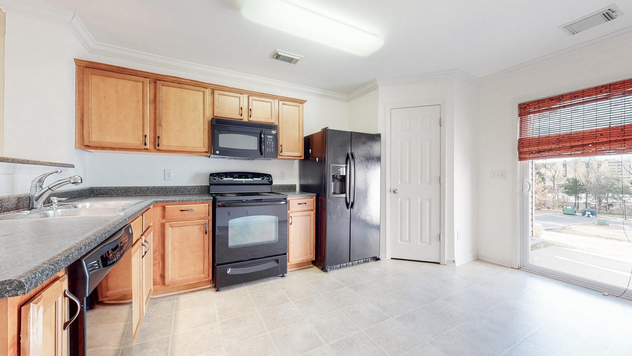 1382 Rural Hill Road, Unit 186 Antioch, TN 37013 - Photo 8 of 21 a kitchen with stainless steel appliances granite countertop a refrigerator sink and stove
