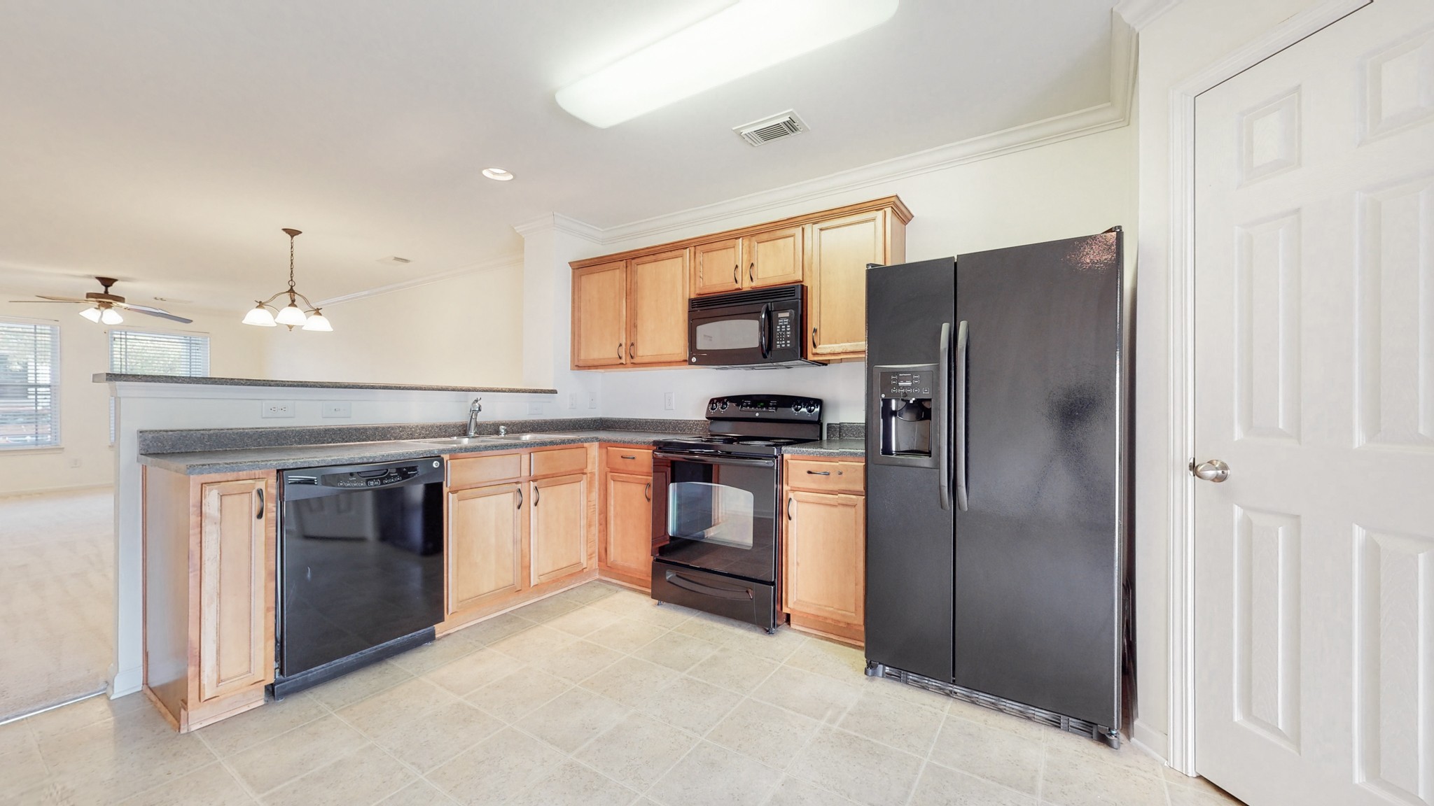 1382 Rural Hill Road, Unit 186 Antioch, TN 37013 - Photo 9 of 21 a kitchen with a refrigerator and a stove top oven