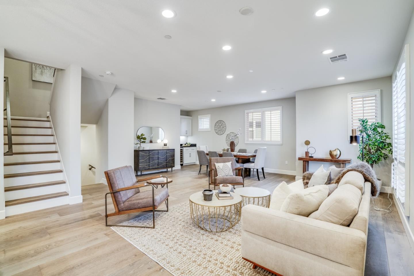 416 Neves Road San Mateo, CA 94403 - Photo 13 of 40 a living room with furniture and a potted plant