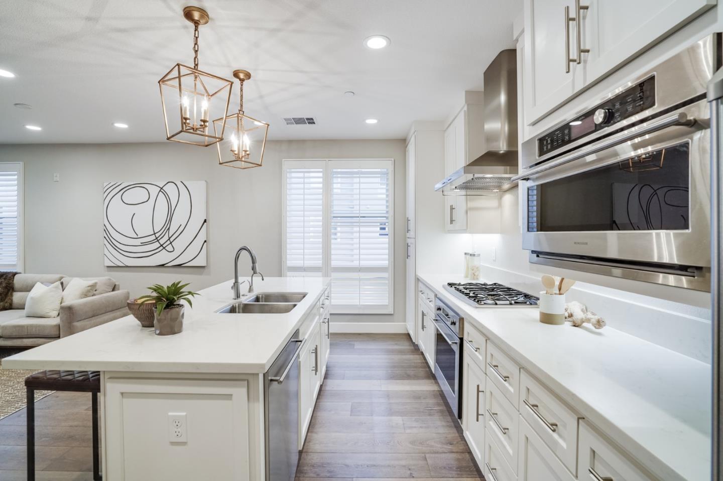 416 Neves Road San Mateo, CA 94403 - Photo 19 of 40 a kitchen with a sink stove and microwave