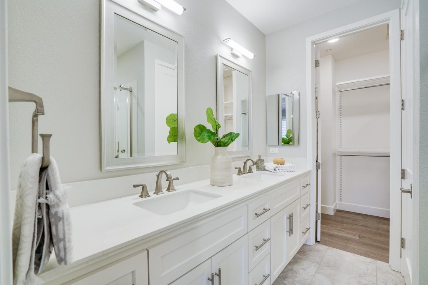 416 Neves Road San Mateo, CA 94403 - Photo 26 of 40 a bathroom with double vanity sink and a mirror